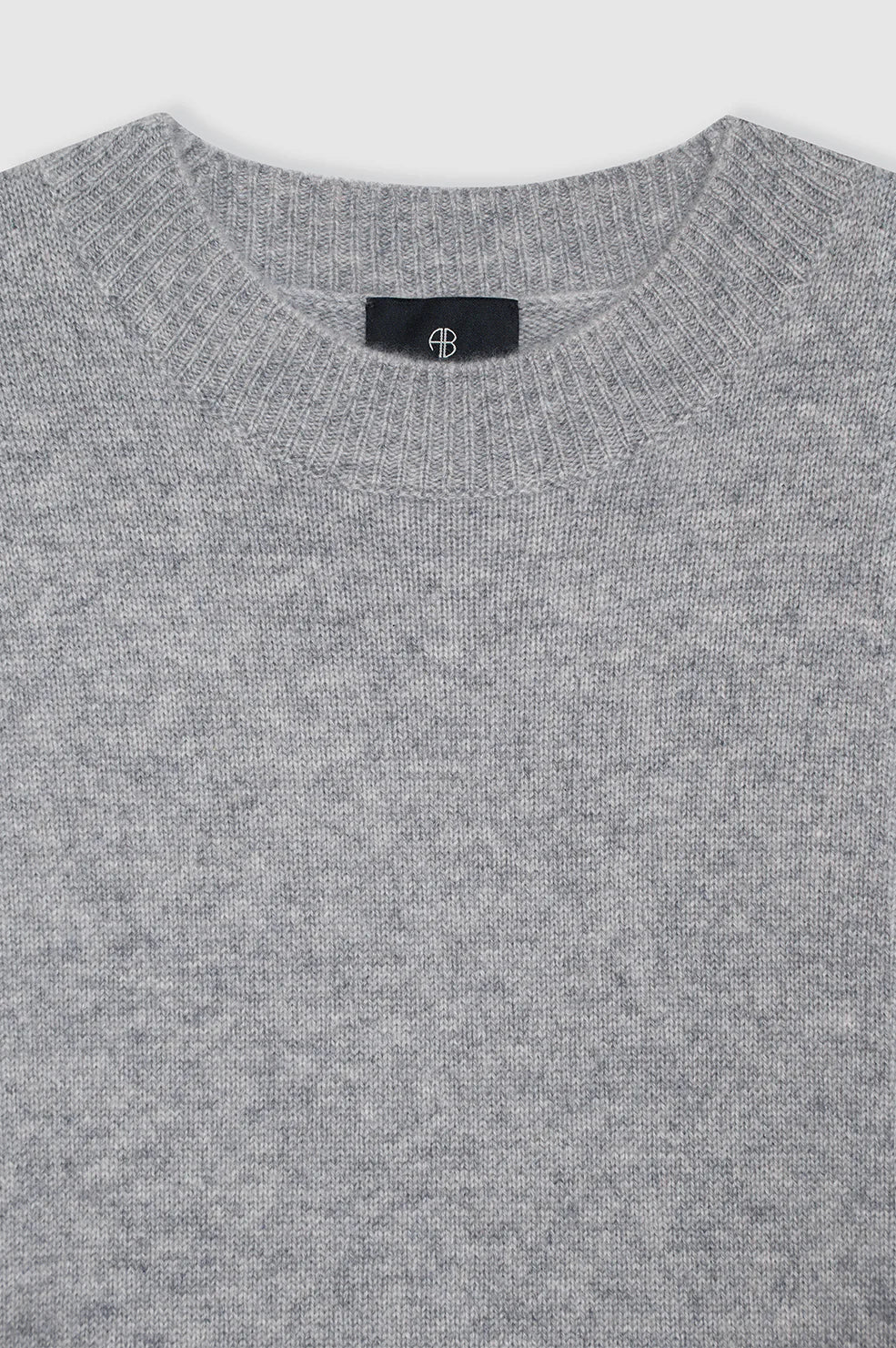 Grey cashmere crew neck sweater from Anine Bing won a light gray background