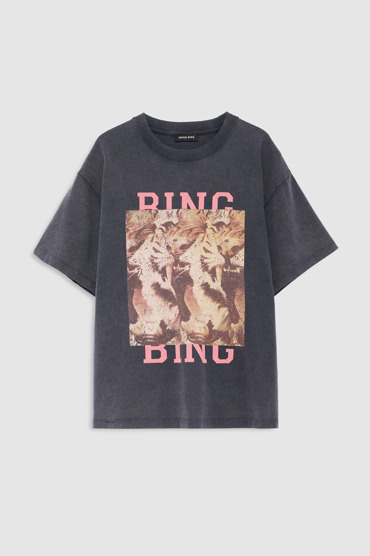 A dark gray washed graphic t-shirt featuring a central square print of a tiger and the word 'BINGO' in pink letters above and below, displayed on a light gray background.
