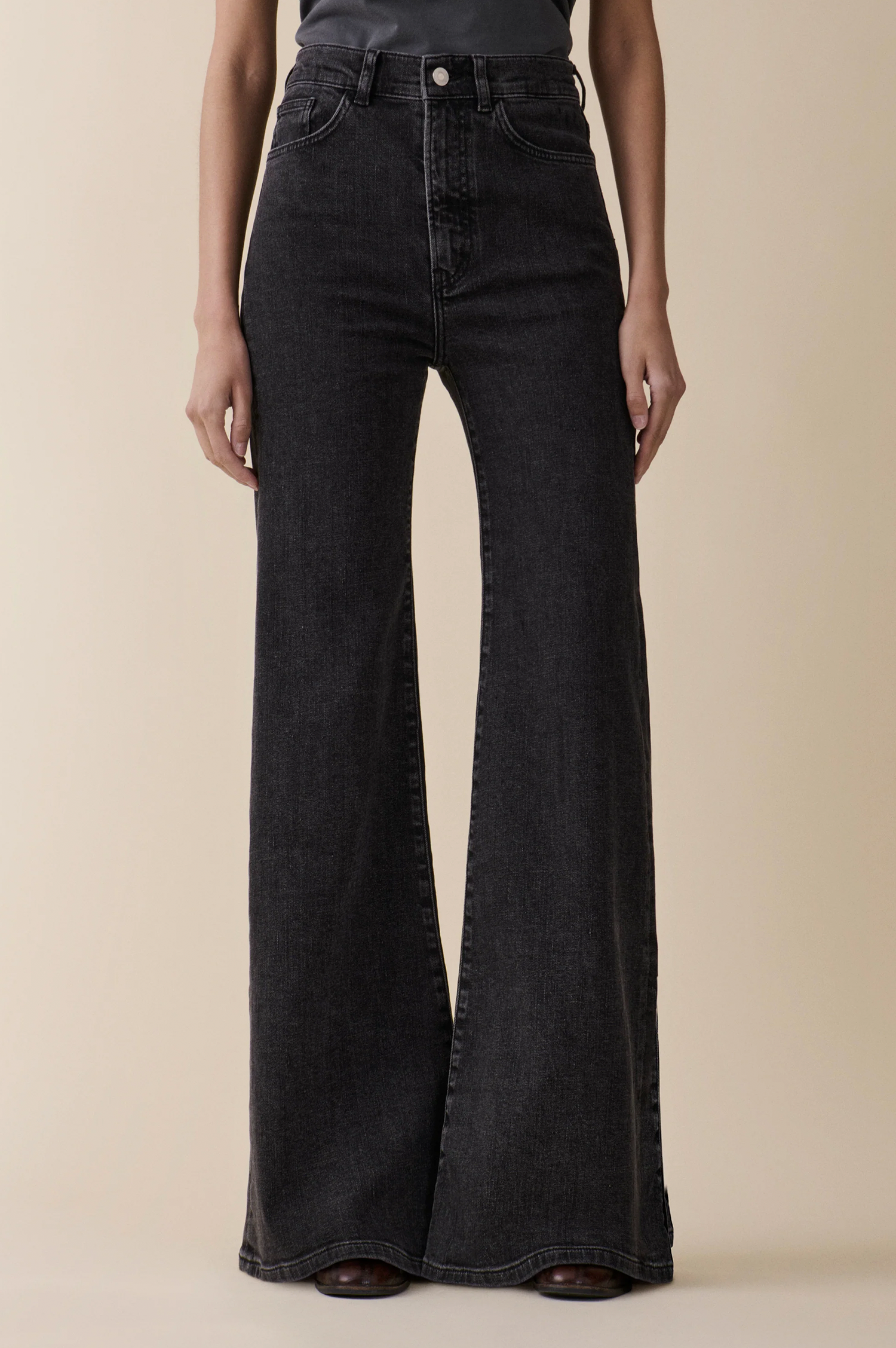 Fuji washed black in flare style from jeanerica looking chic on model