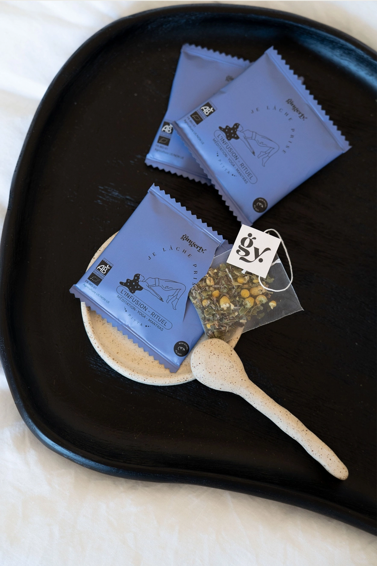 Herbal infusion tea bags on a plate
