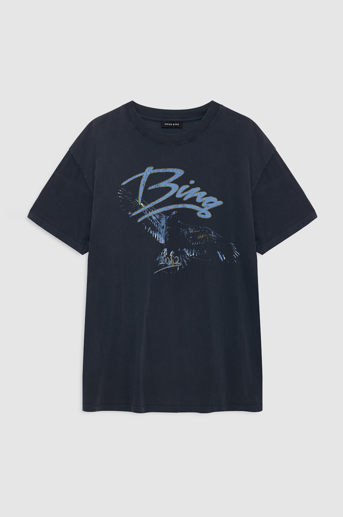 Black t-shirt with blue graphic design on a light gray background