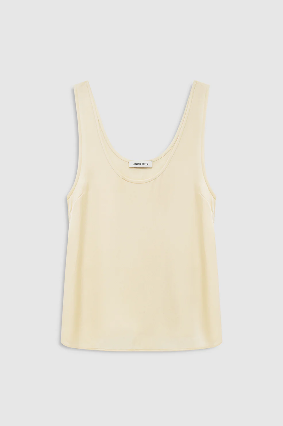 Yellow tank top on a light gray background