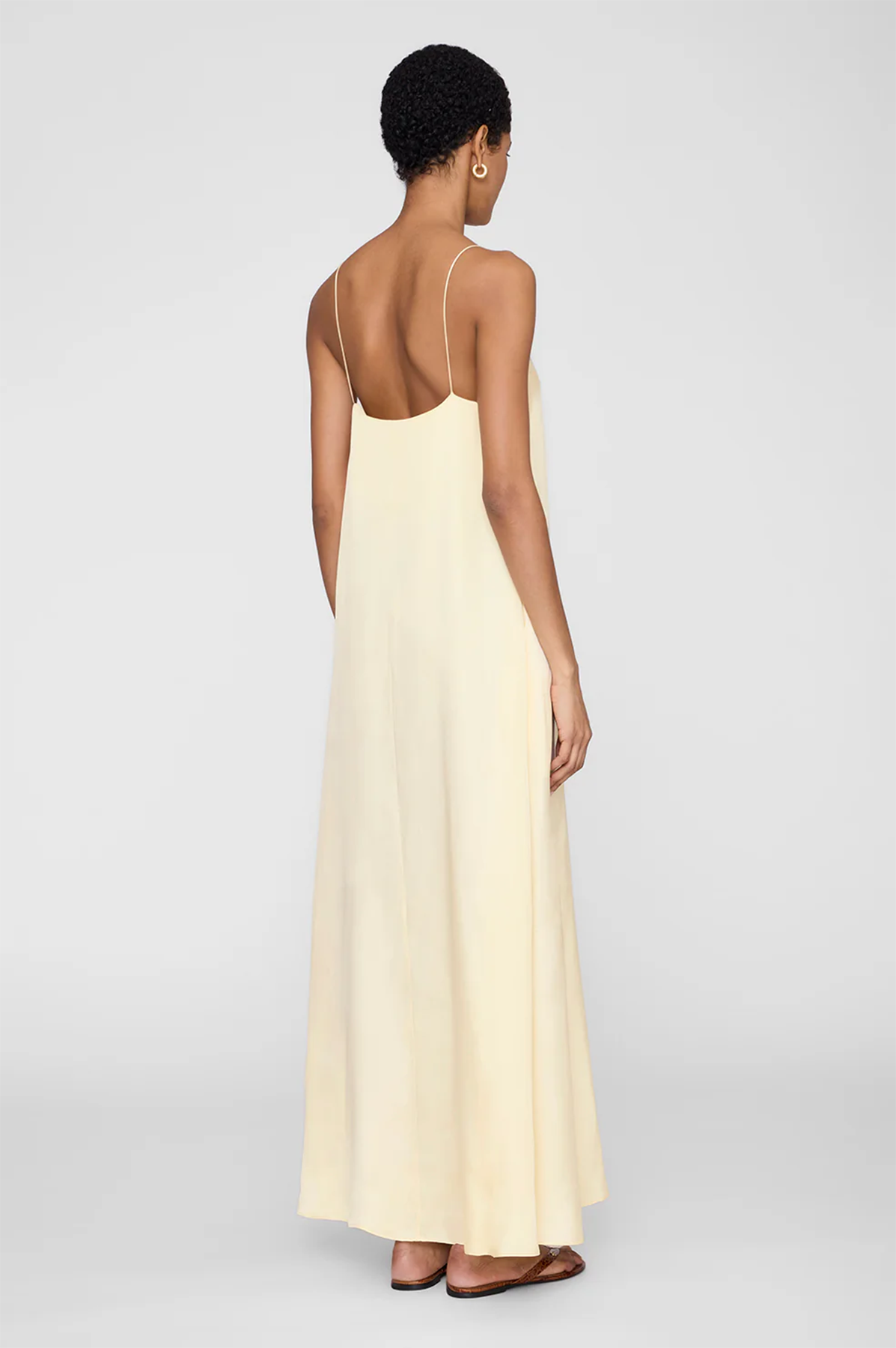 anine bing mae dress in silk in color butter yellow on model