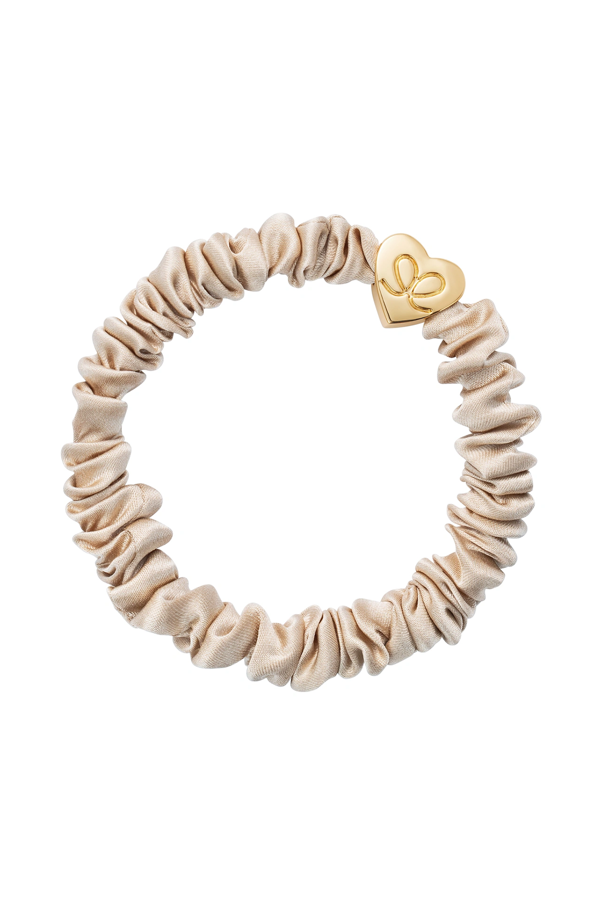 Beige scrunchie with a gold heart-shaped clip on a white background