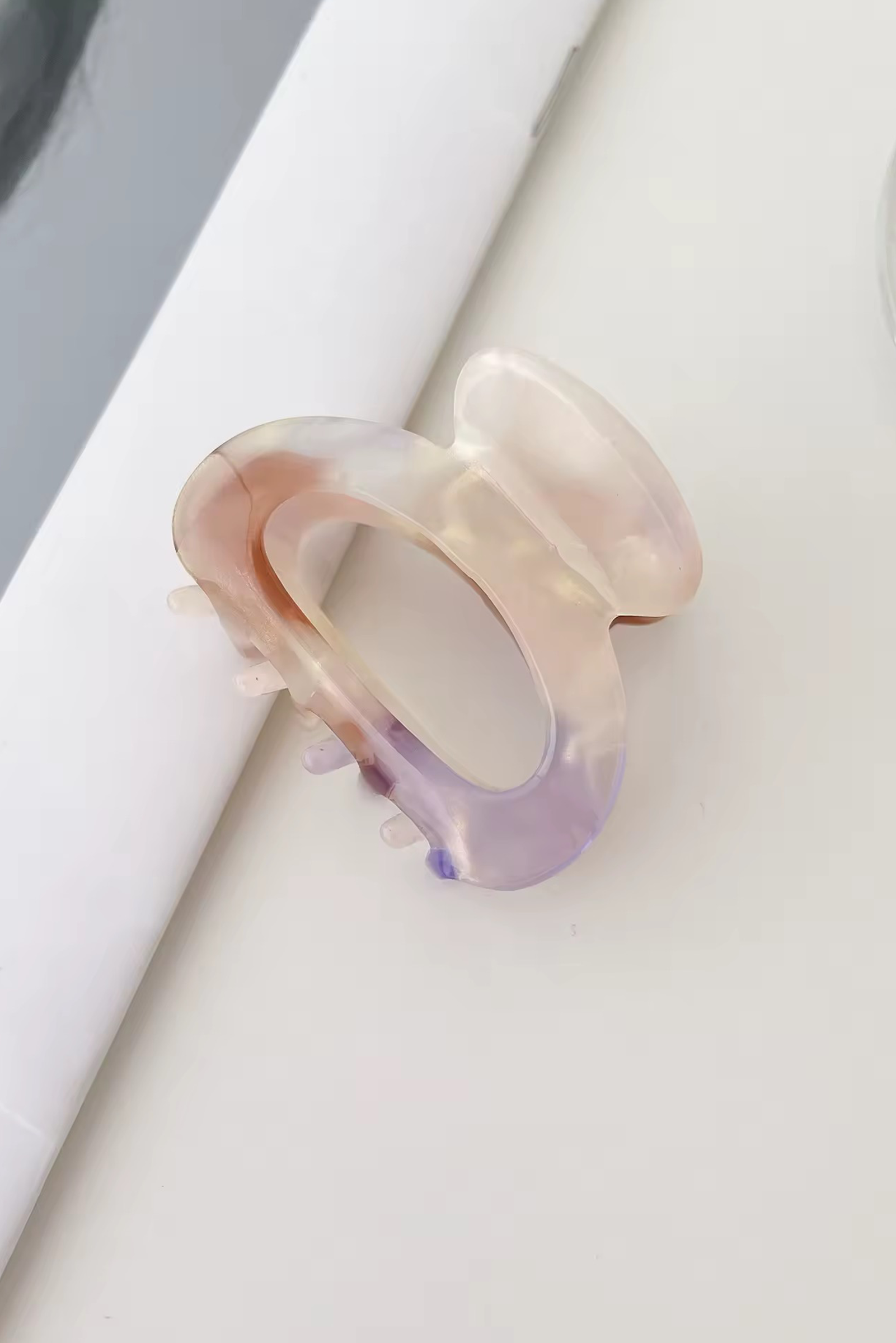 Multicolored ring on a white surface
