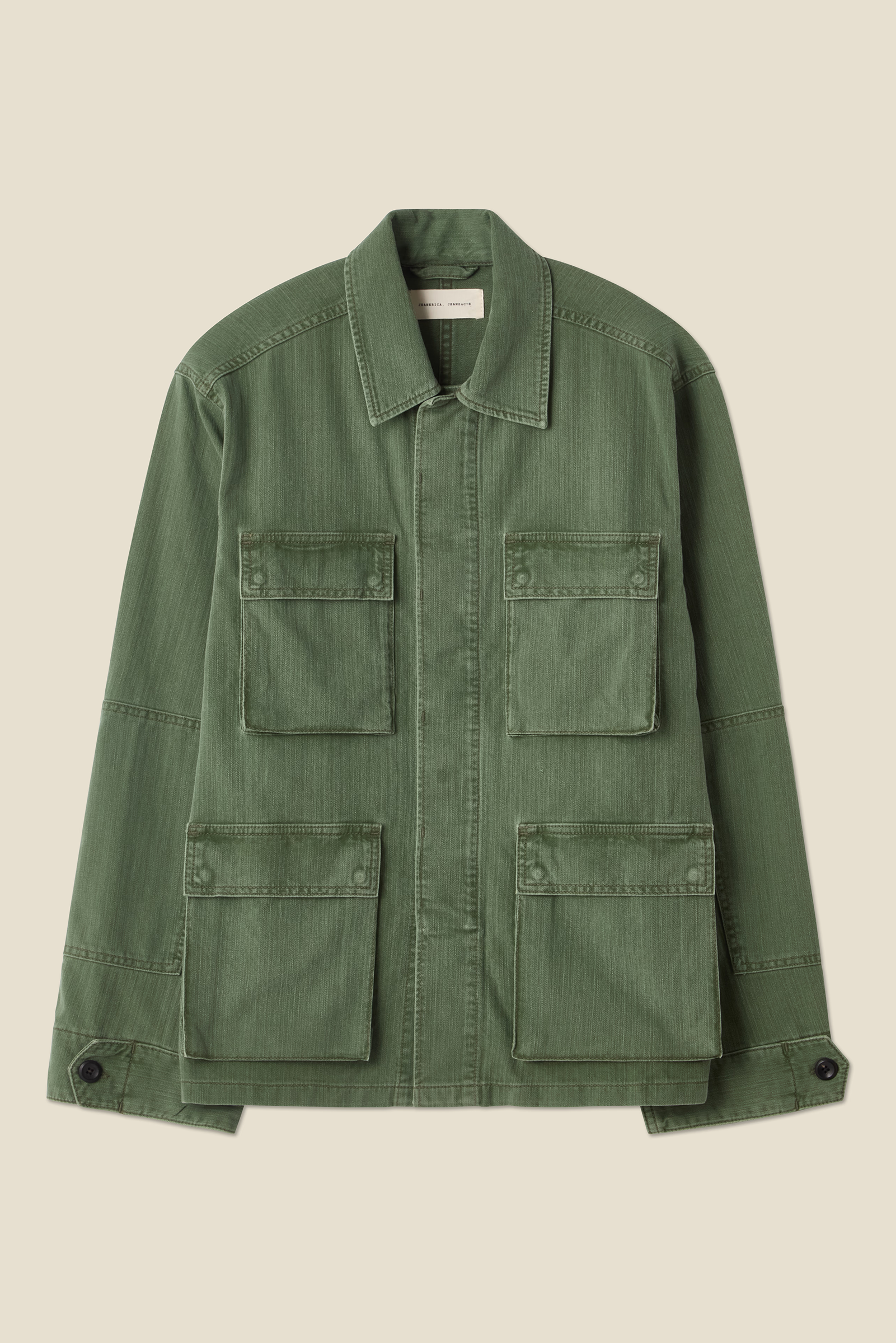 flatlay of lucy jacket in chevron green from jeanerica